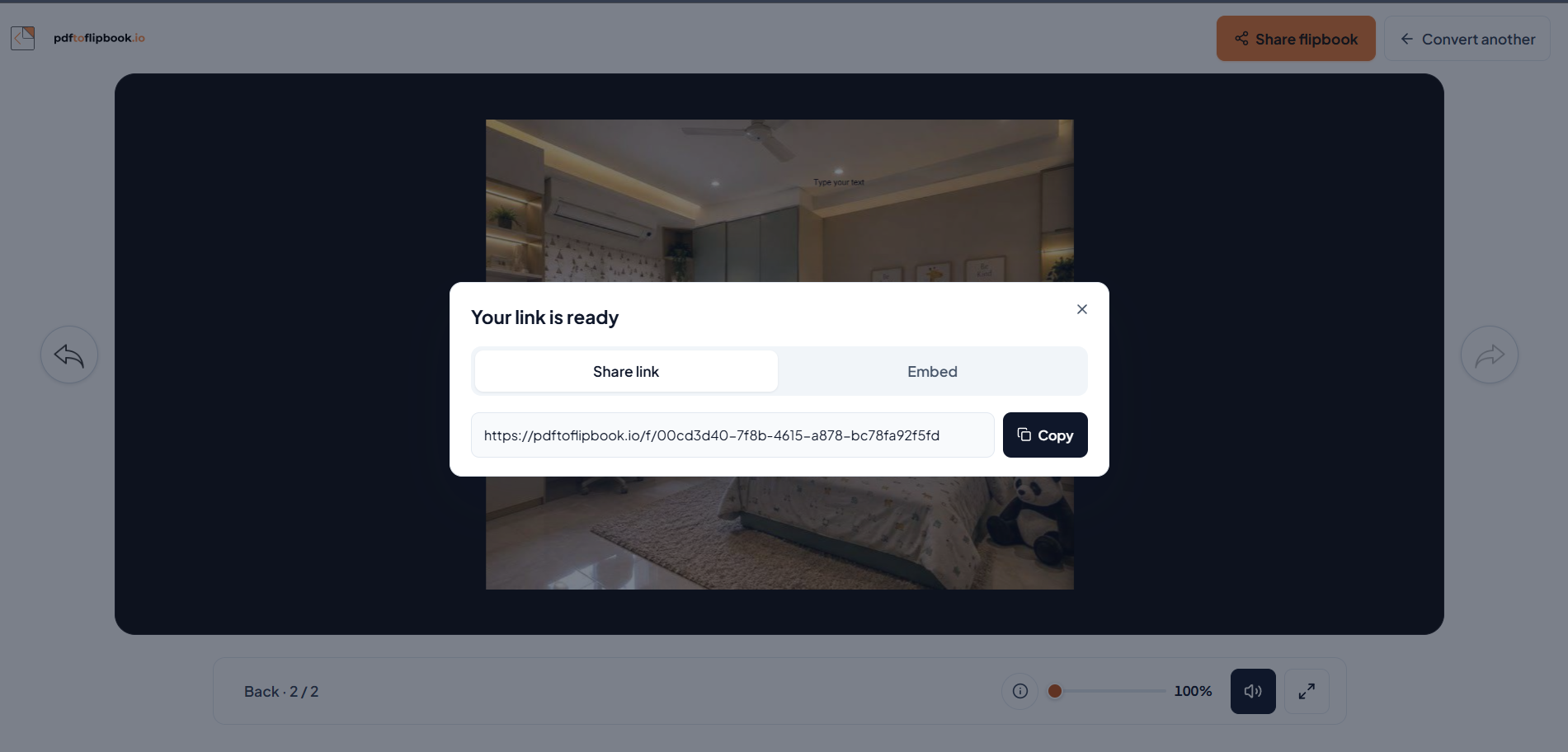 The share card over a flipbook, with the Share link tab selected, a public link in the field, and a Copy button